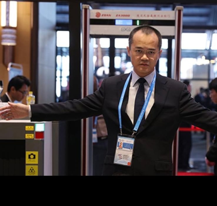 Security staff at an event entrance checkpoint